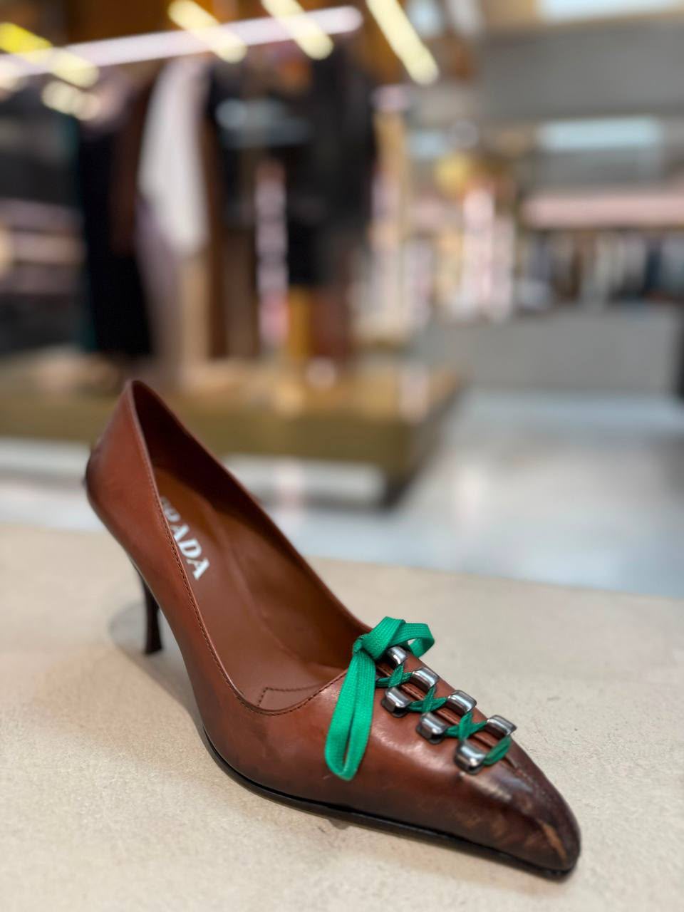 Feather-embellished lace-up pumps