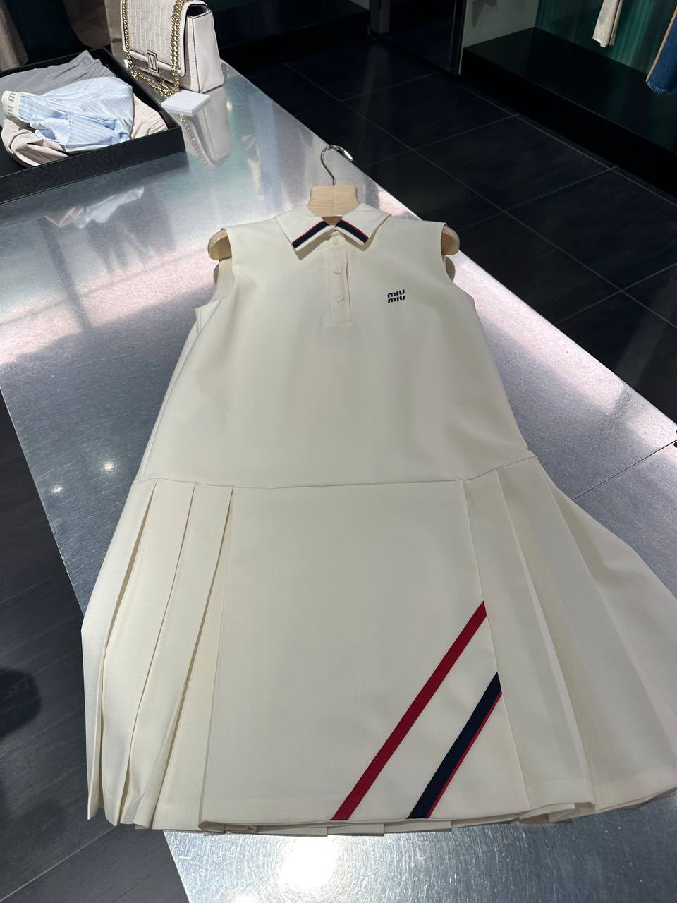 Sleeveless pleated polo dress