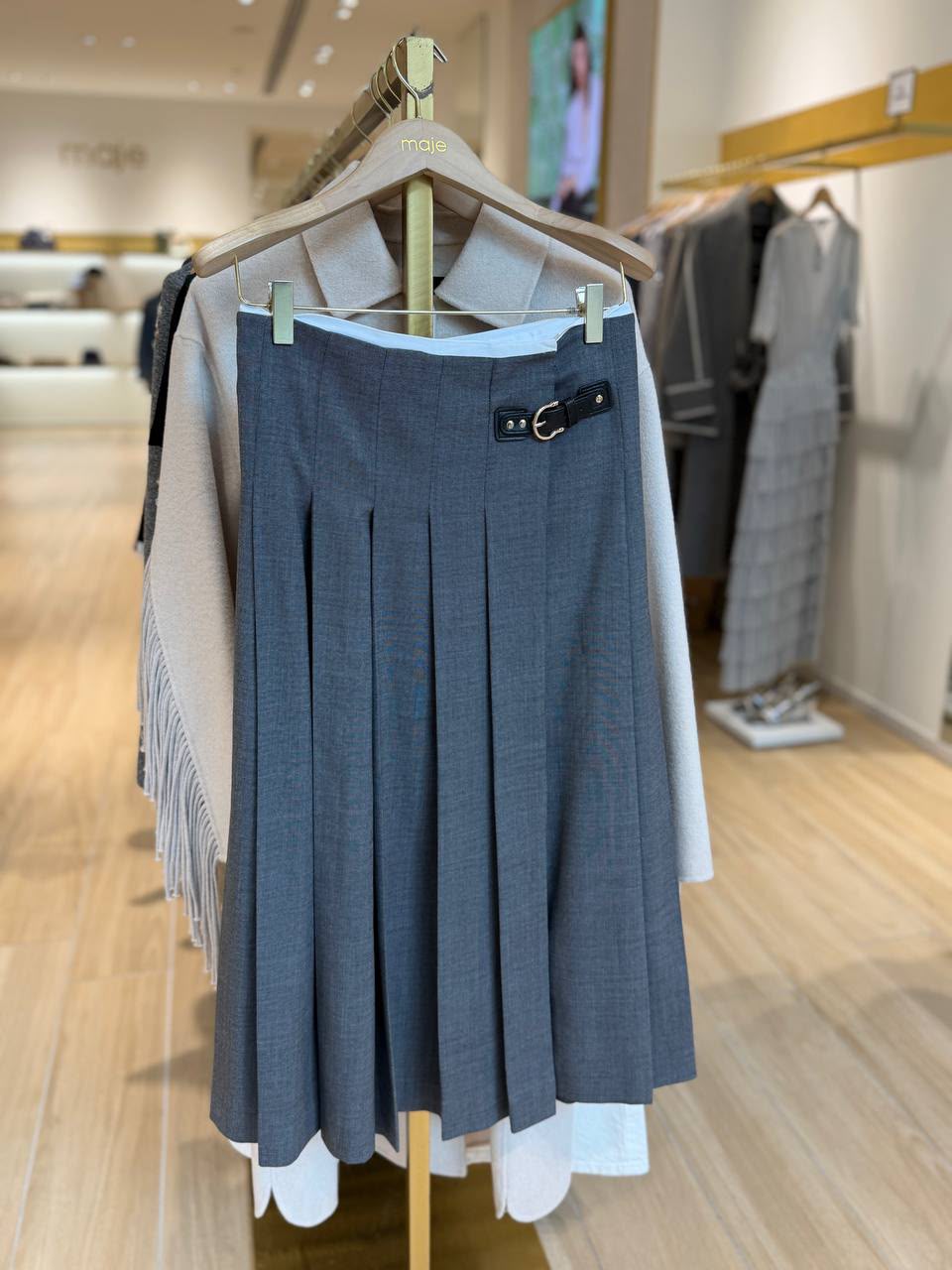Pleated midi skirt with buckled tab