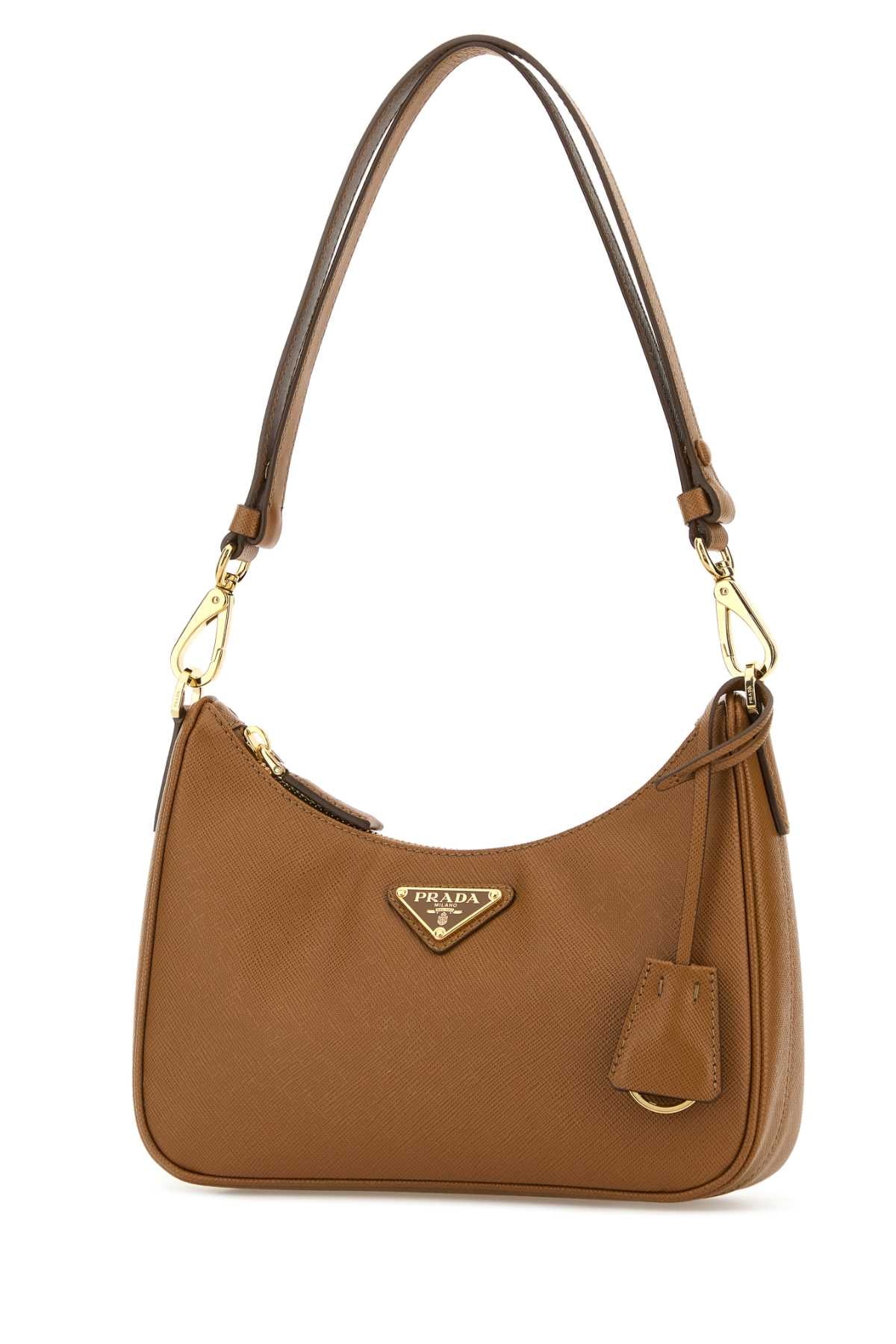 PRADA PELLE For Women Exterior: 100% Leather Lining: 100% Re-Nylon Finishing: Golden metal