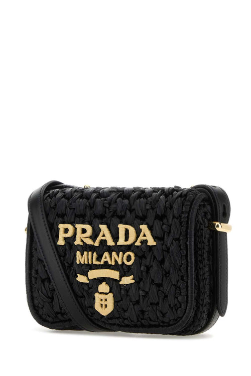 PRADA BORSA For Women Exterior: 100% Raffia 100% Leather Lining: 100% Leather Finishing: Golden metal