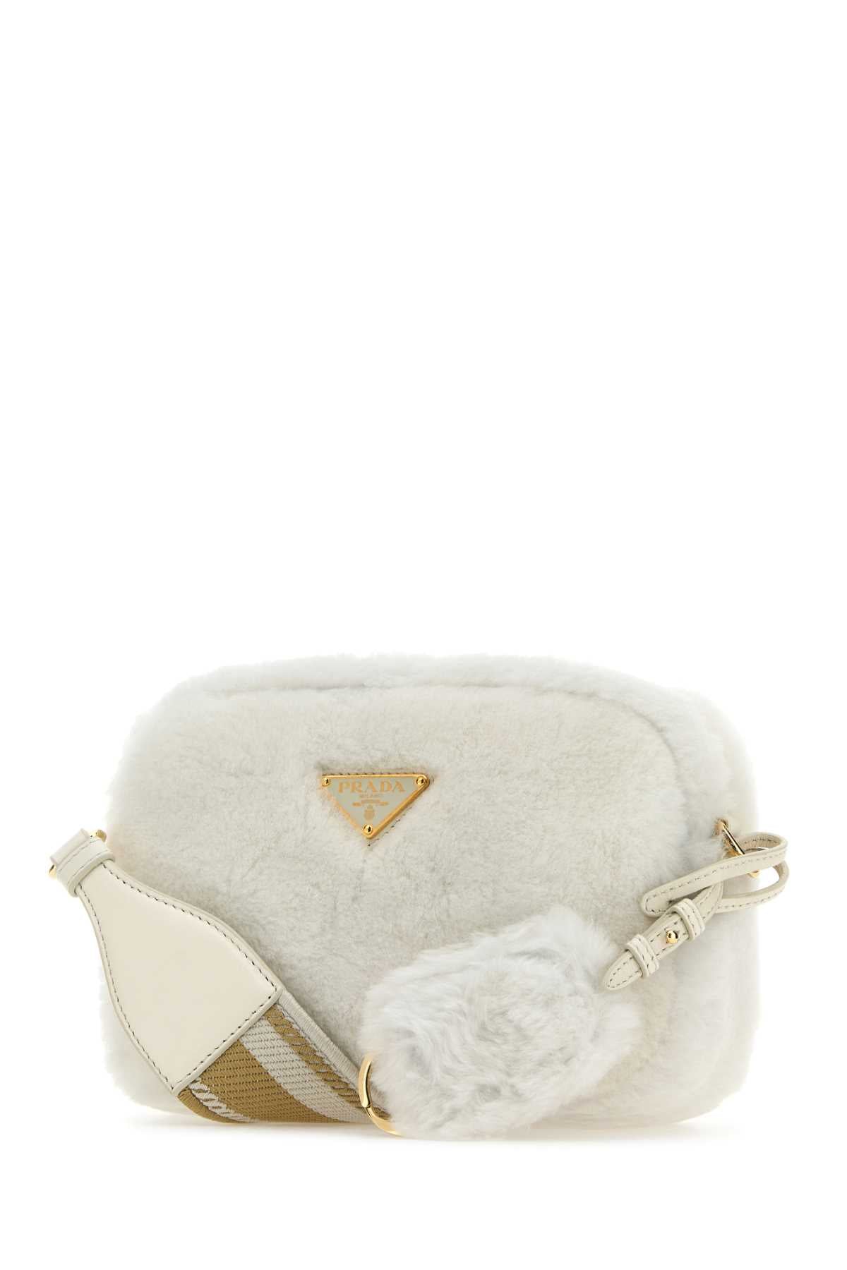 PRADA BANDOLIERA For Women Exterior: 100% Shearling Lining: 100% Leather 100% Fabric Finishing: Golden metal