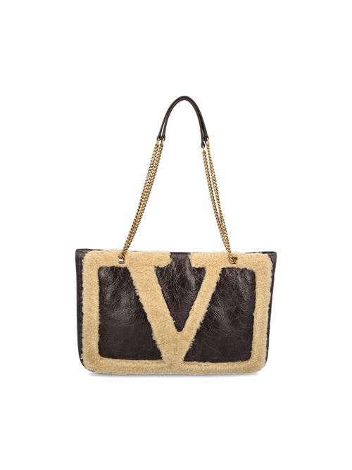 Borsa realizzata in pelle e montone
