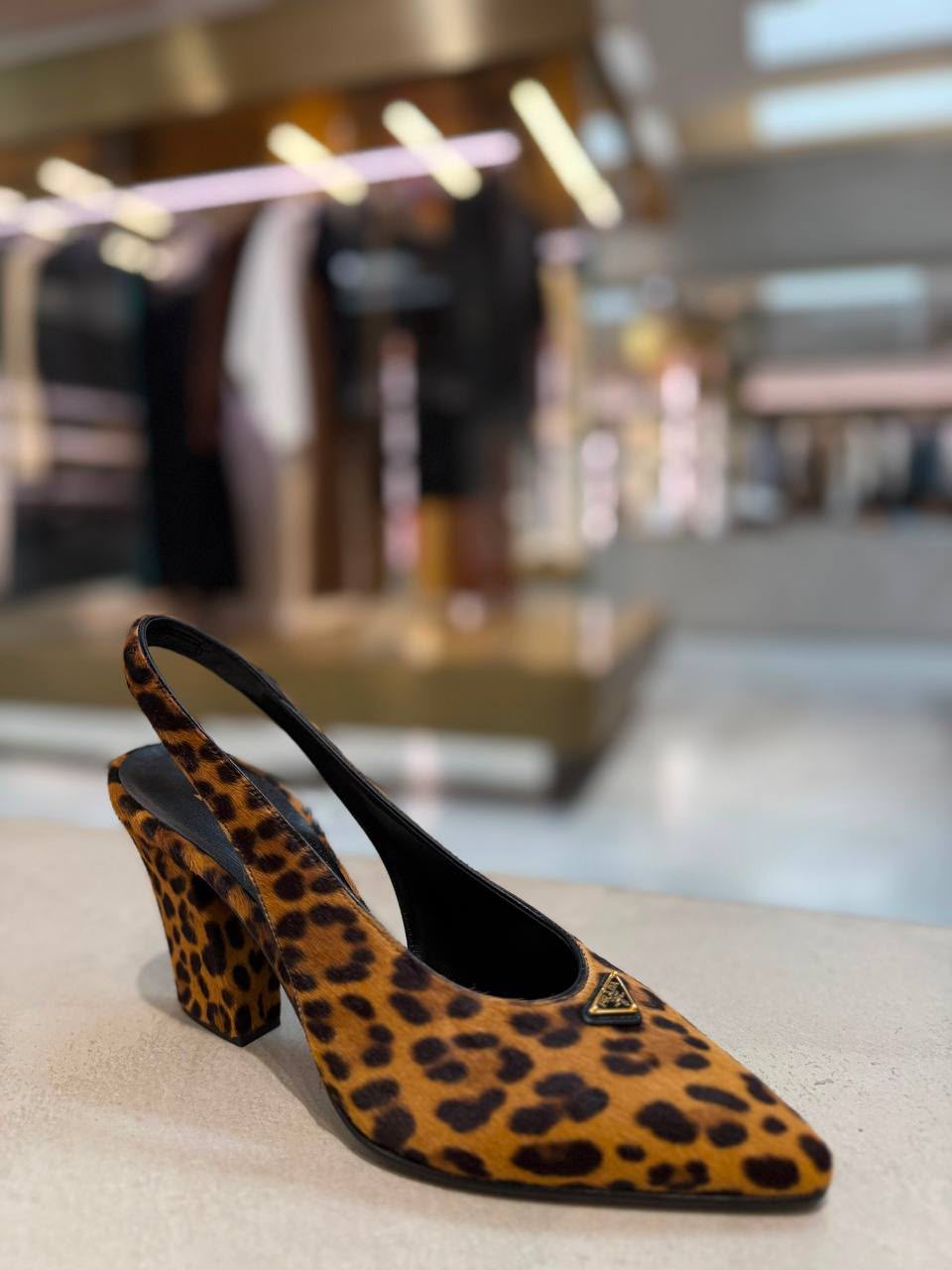 Leopard-print calf hair slingback pumps