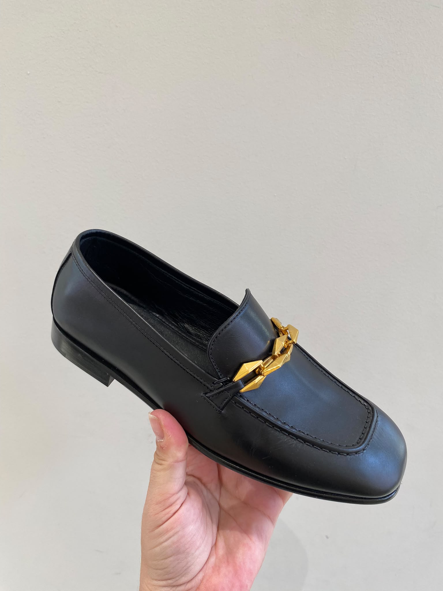 Chain-embellished leather loafers