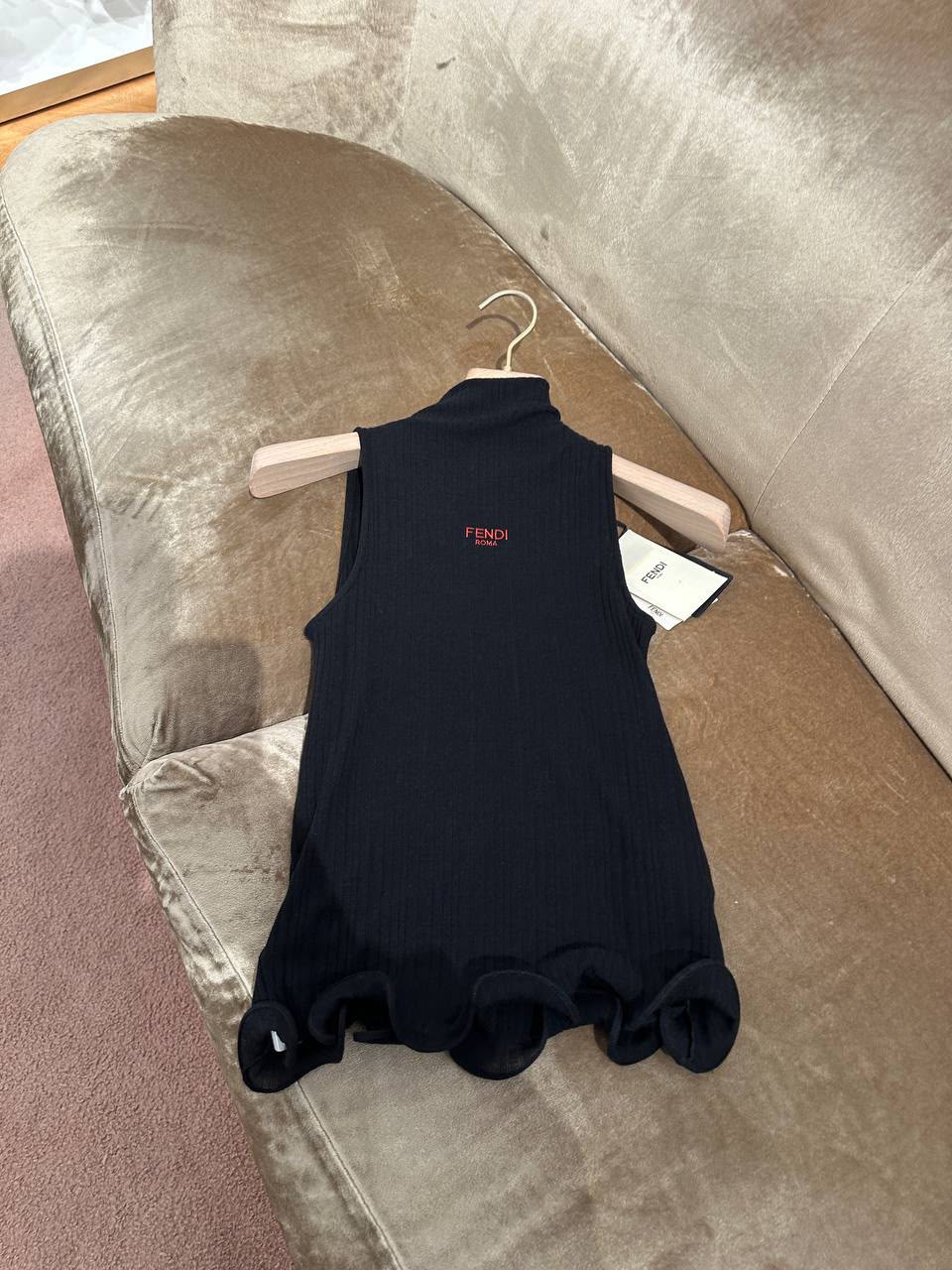 Ribbed Knit Sleeveless Top with Ruffle Hem