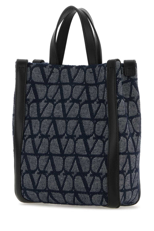 VALENTINO GARAVANI BORSA For Men Exterior: 100% Fabric 100% Leather Lining: 100% Fabric Finishing: Enameled metal