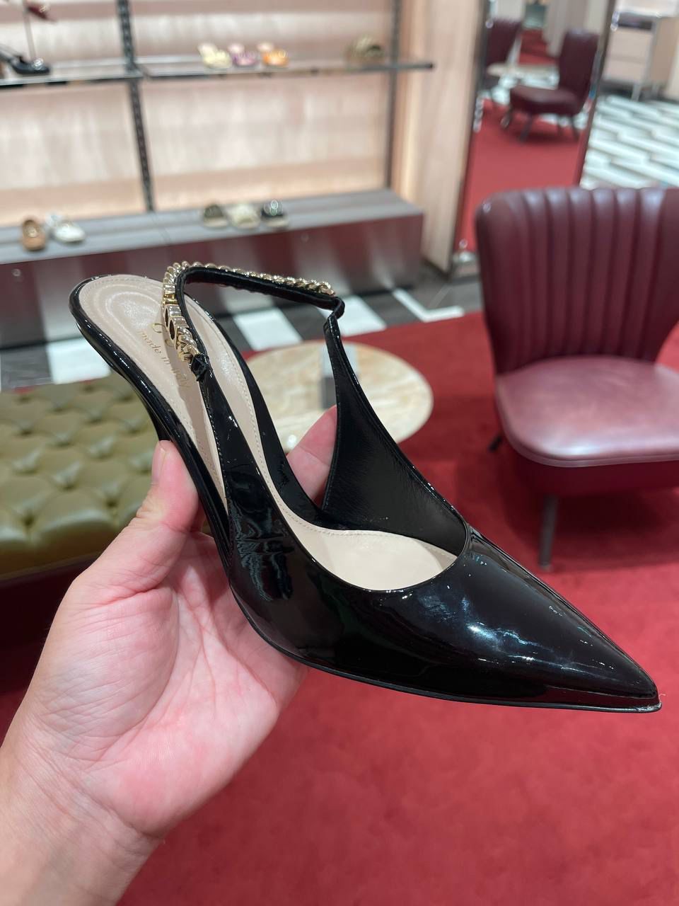 Chain-embellished patent leather slingback pumps