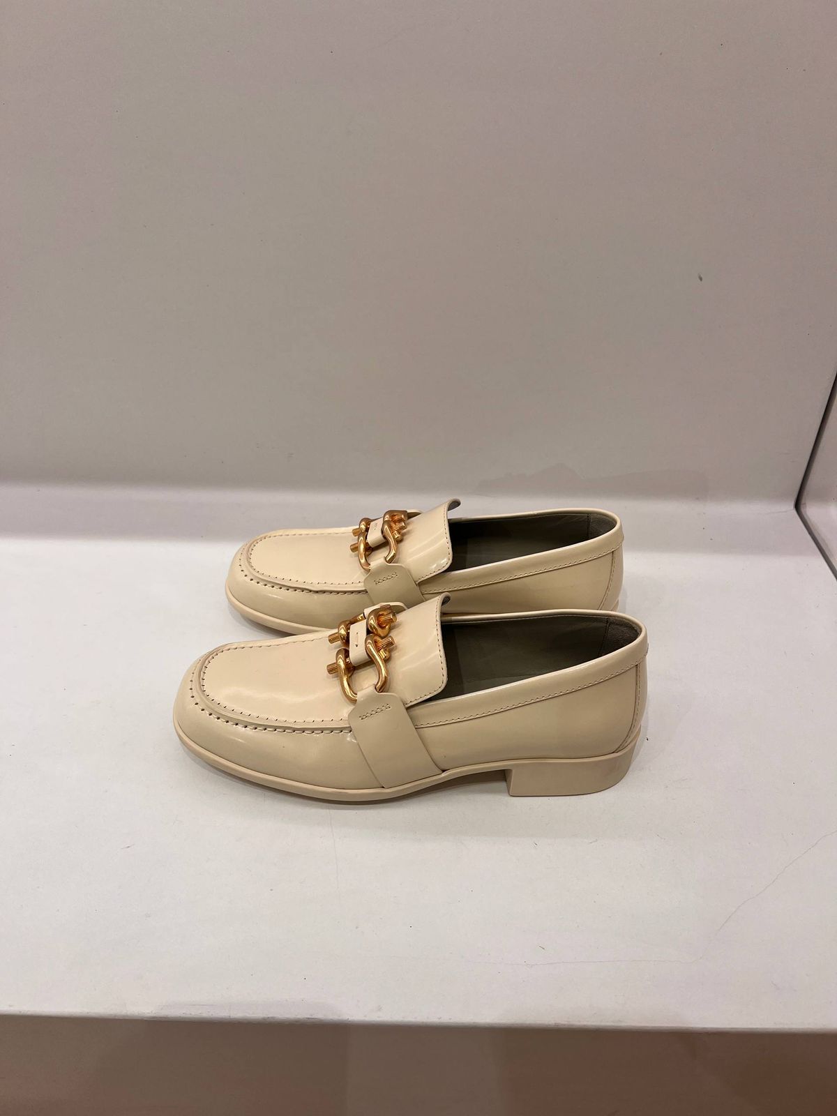 Chain-embellished patent leather loafers