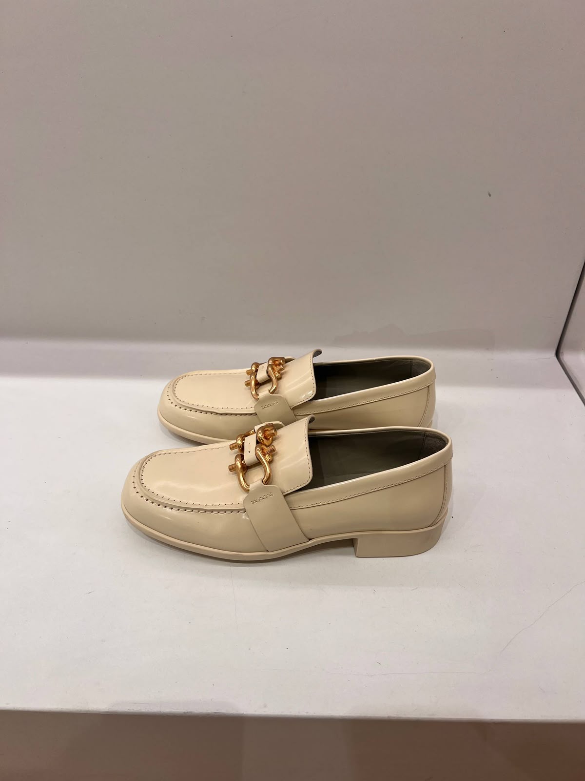 Chain-embellished patent leather loafers