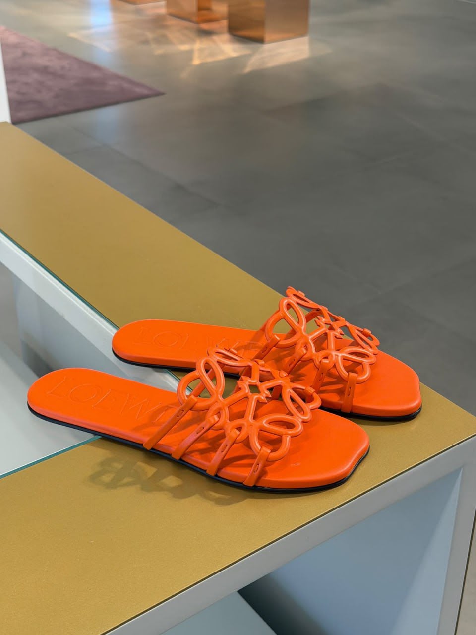 Anagram slide sandals in calfskin