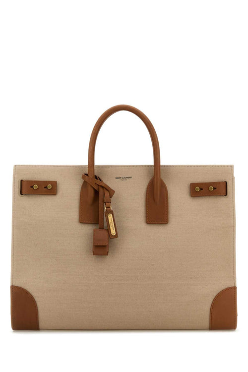 SAINT LAURENT BORSA For Men Exterior: 100% Cotton 100% Calf Lining: 100% Cotton Finishing: Antiqued golden metal