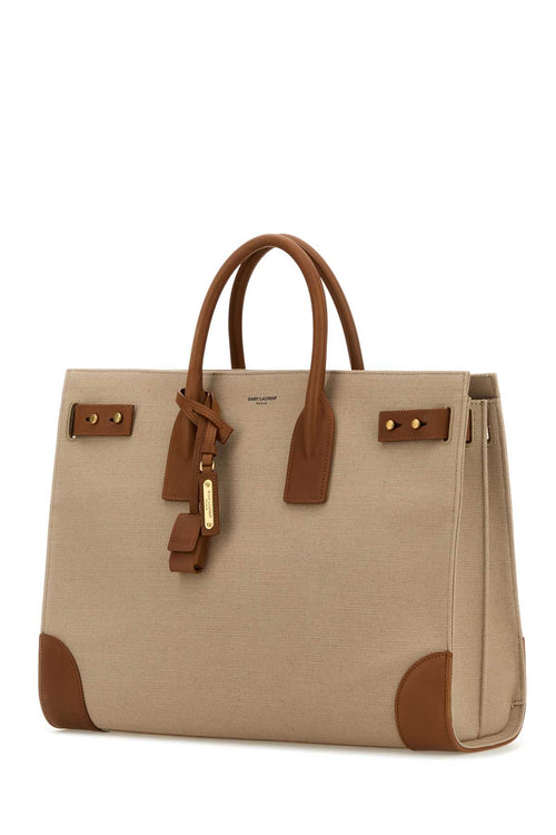 SAINT LAURENT BORSA For Men Exterior: 100% Cotton 100% Calf Lining: 100% Cotton Finishing: Antiqued golden metal