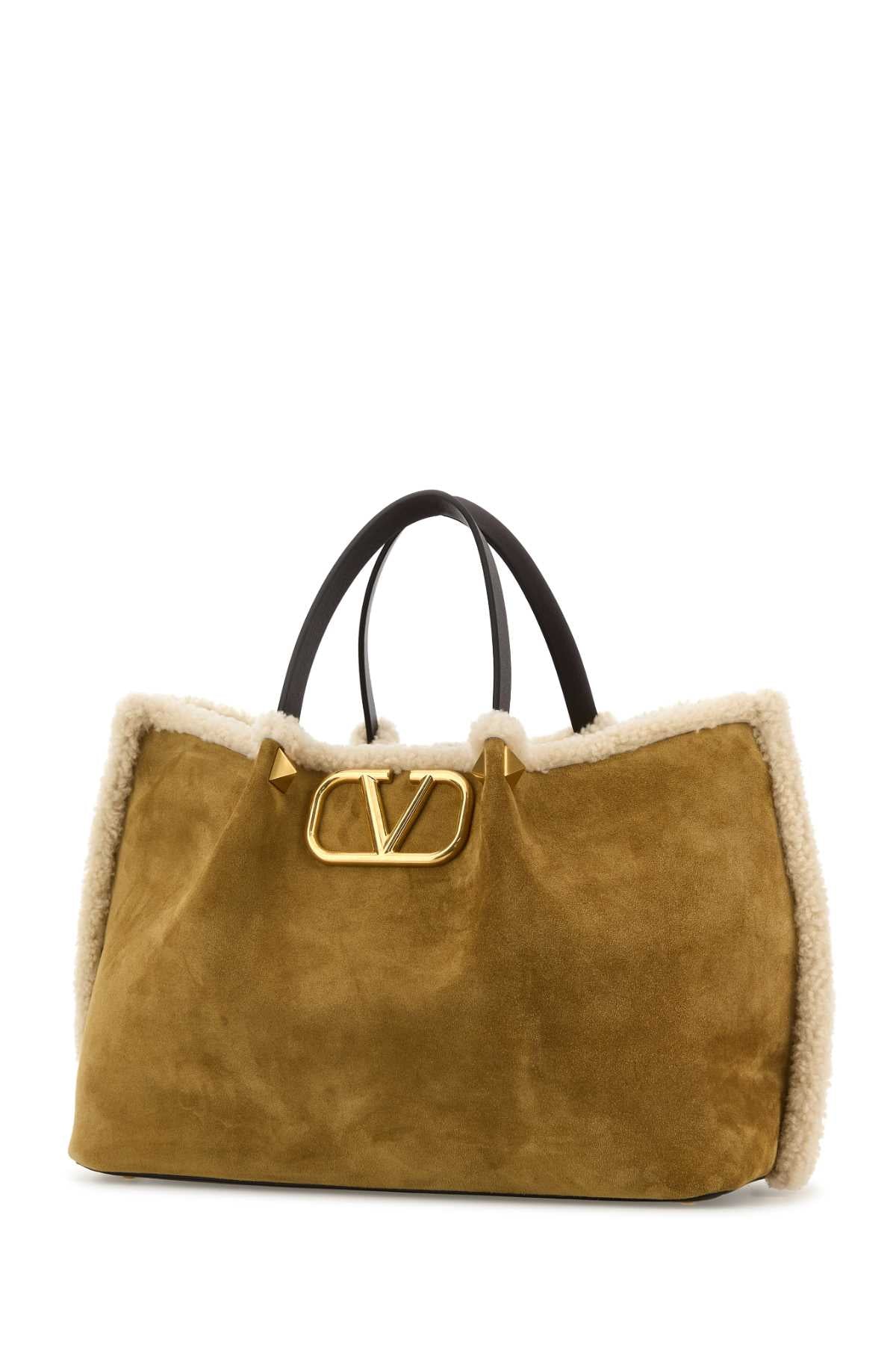 VALENTINO GARAVANI MEDIUM TOTE | VLOGO SIGNA For Women Exterior: 100% Suede Lining: 100% Shearling Finishing: Antiqued golden metal