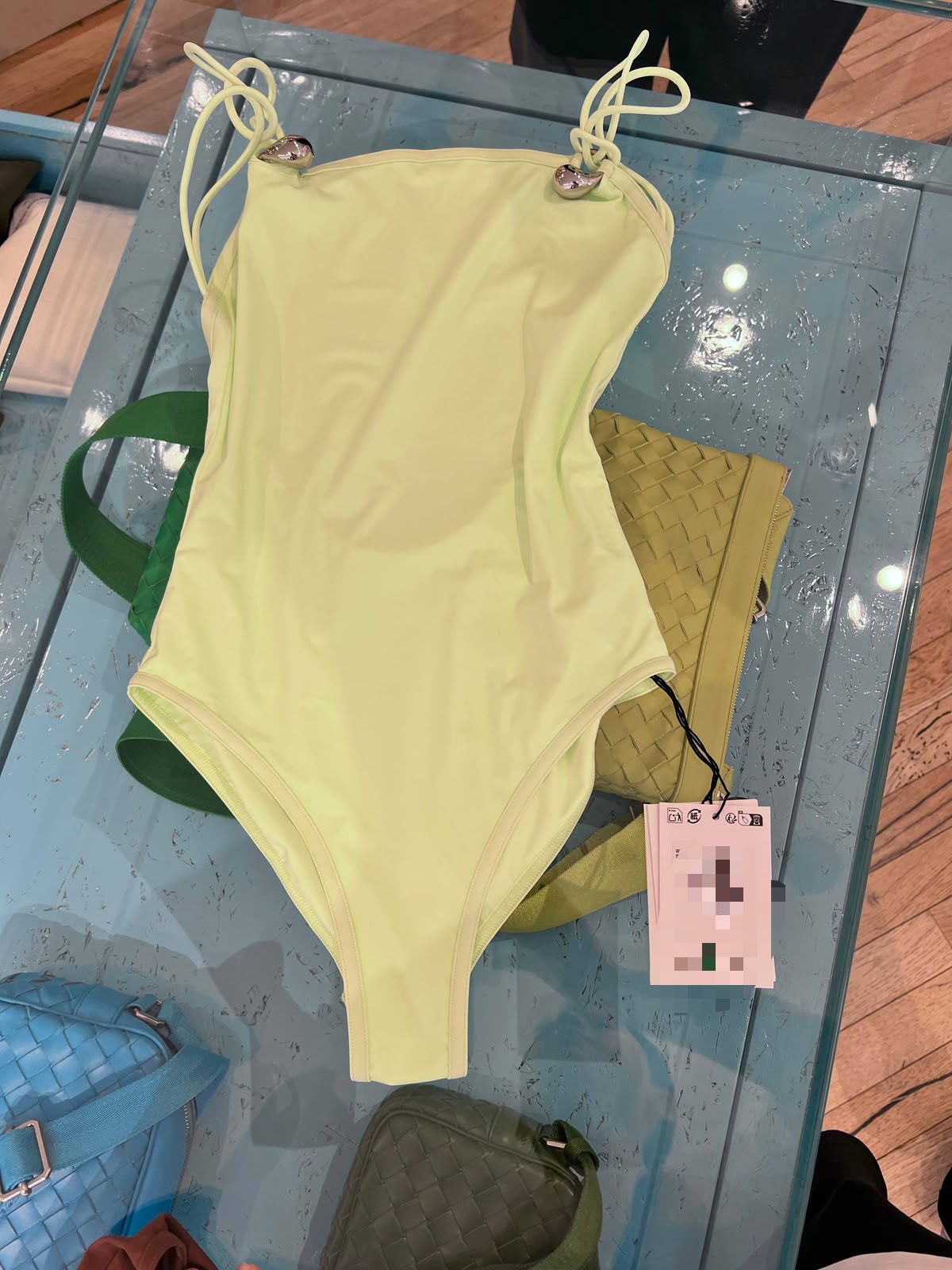 One-piece swimsuit with metal hardware