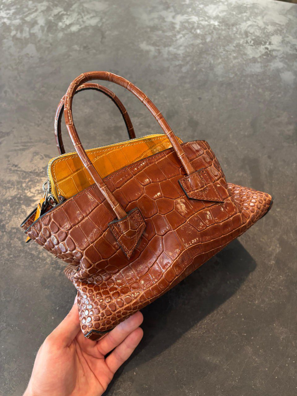Crocodile-embossed leather handbag