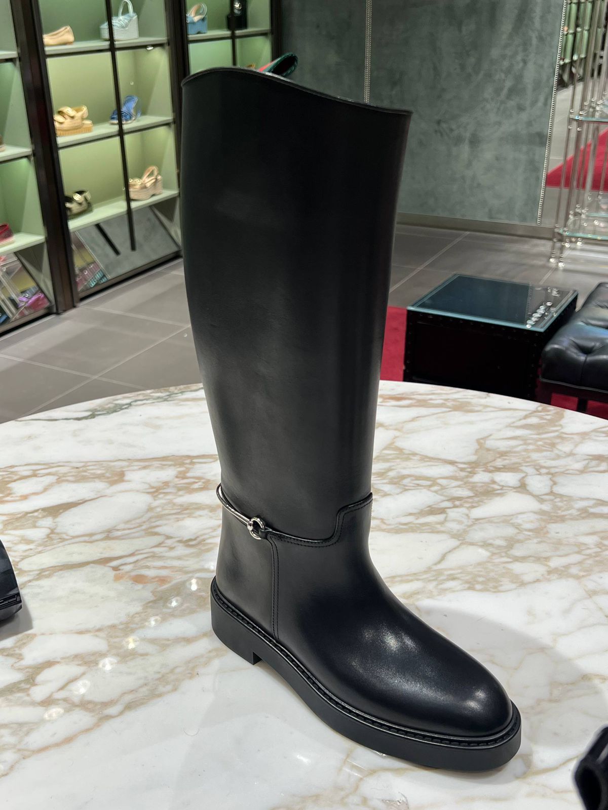 Horsebit knee-high boot