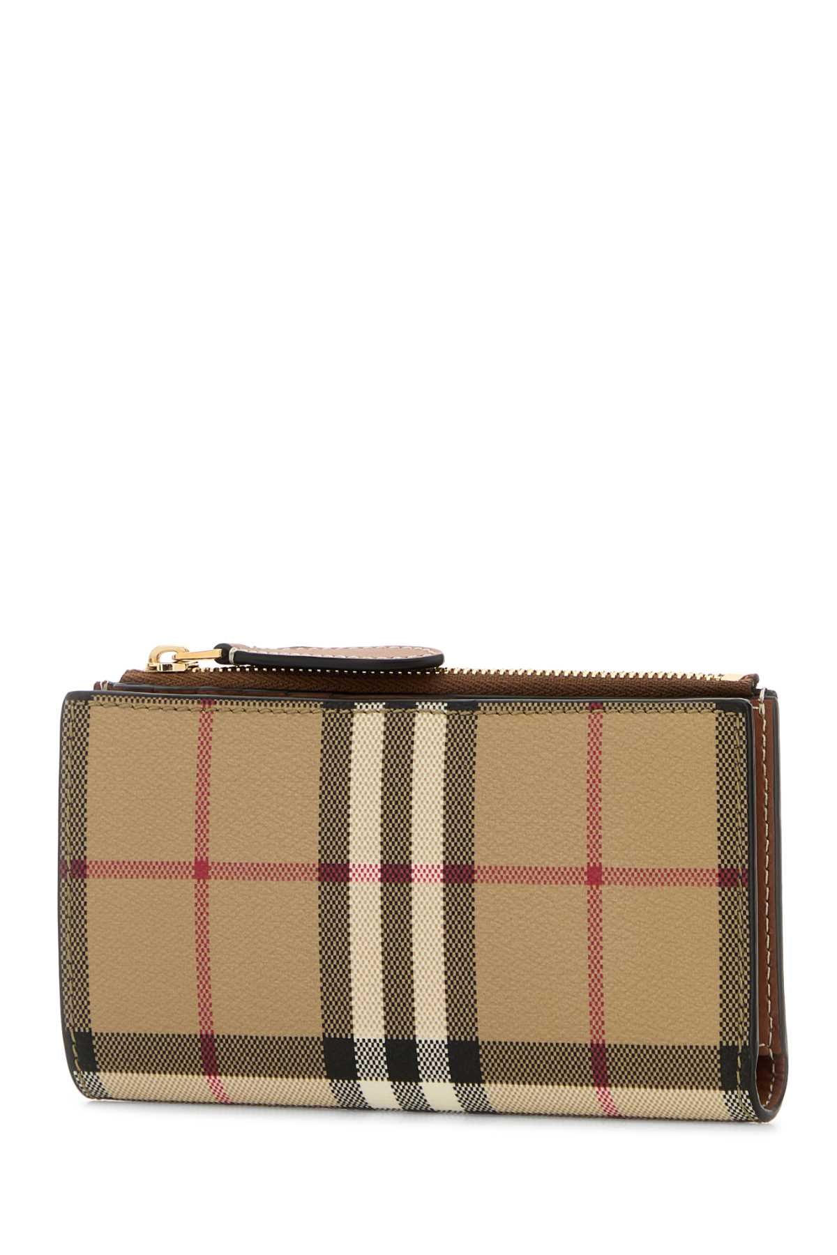 BURBERRY LS MD BIFOLD DFC For Women Exterior: 55% Polyurethane 25% Polyester 20% Cotton Finishing: Golden metal