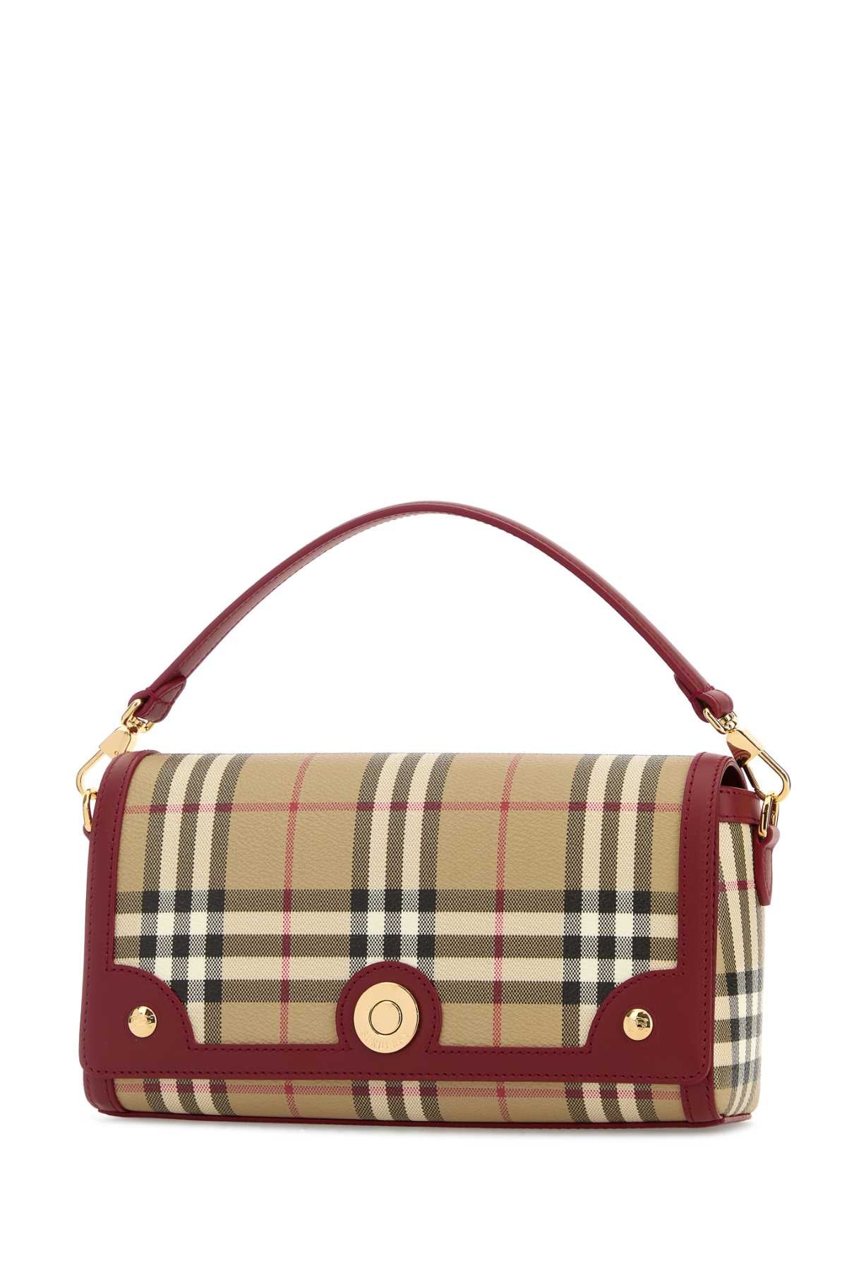 BURBERRY LL SM NOTE DFC For Women Exterior: 55% Polyurethane 25% Polyester 20% Cotton Lining: 100% Cotton Finishing: Golden metal