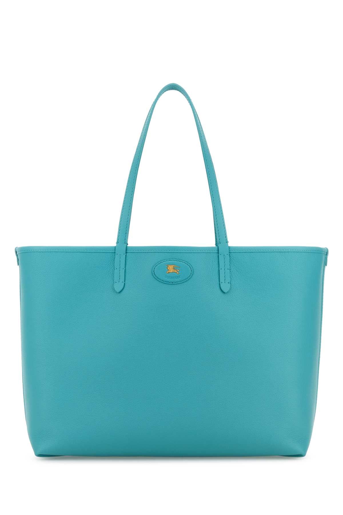 BURBERRY LL MD REVERSIBLE TOTE C&L For Women Exterior: 100% Calf Lining: 69% Cotton 21% Viscose 10% Linen Finishing: Golden metal