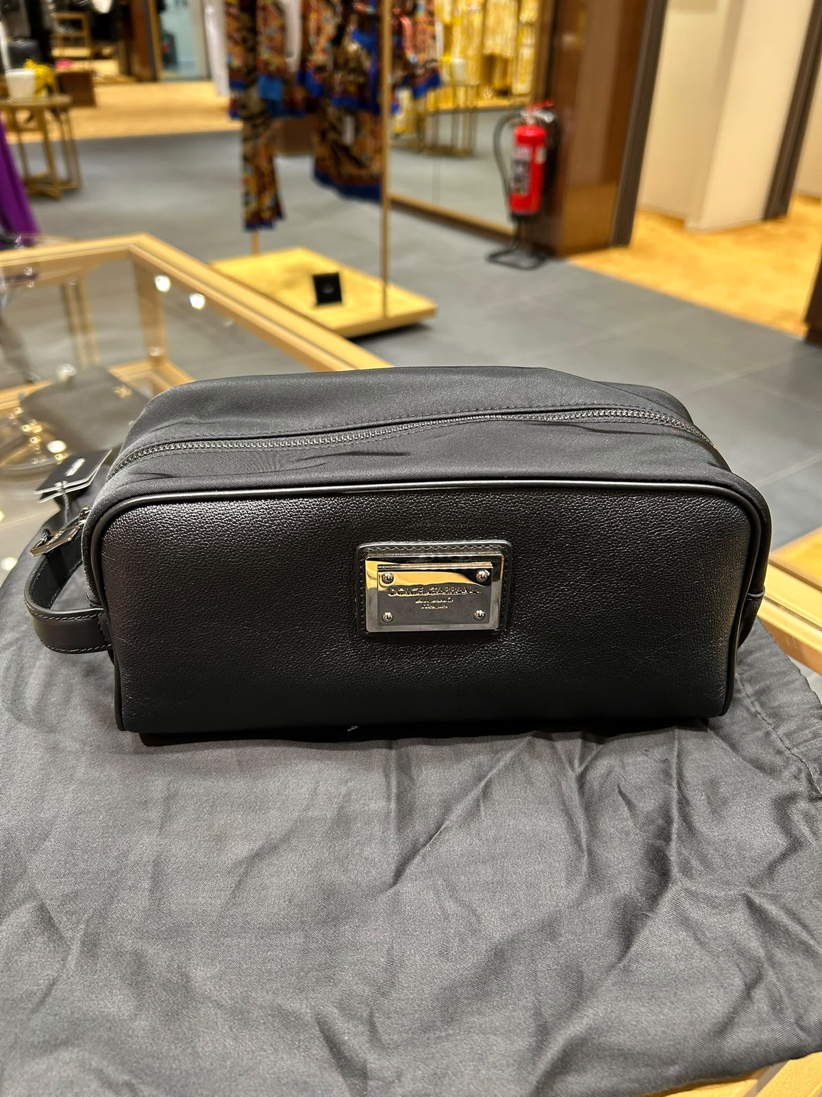 Nylon and Dauphine calfskin wash bag with logo plate