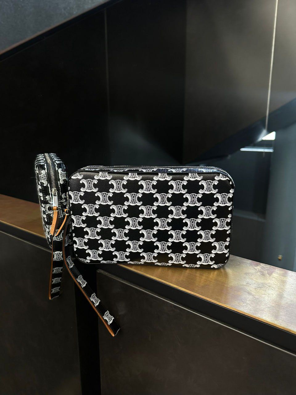 Clutch with Wrist Strap in Triomphe Canvas