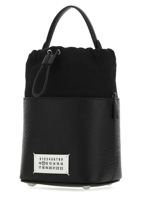 MAISON MARGIELA BORSA For Women Corpo: 100% Pelle Bovina - Contrasto: 79% Cotone 16% Poliestere 5% Altre Fibre - Fodera: 100% Cotone - Interno: 100% Pelle Bovina - Minuteria Metallica: 60% Ottone 40% Zinc Alloy - Minuteria Metallica 1: 100% Zama - Minuteria Metallica 2: 100% Ottone