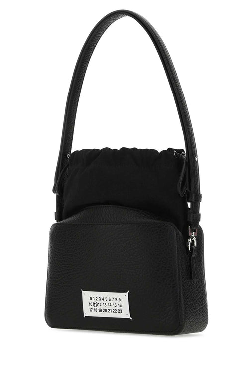 MAISON MARGIELA BORSA For Women Exterior: 100% Bovine leather 79% Cotton 15% Polyester 6% Other fibers Lining: 100% Cotton Finishing: Silver metal