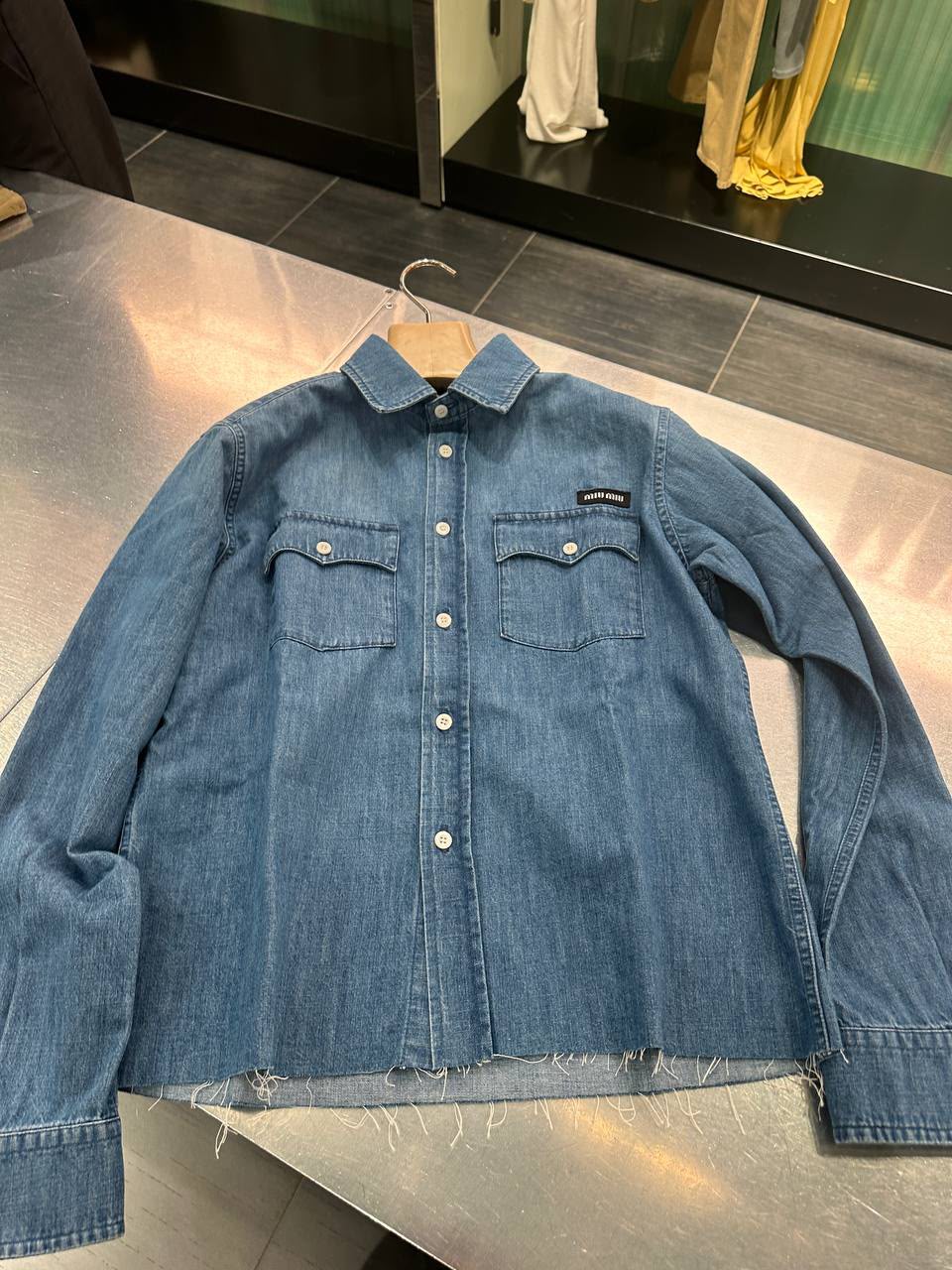 Denim shirt with raw-cut hem