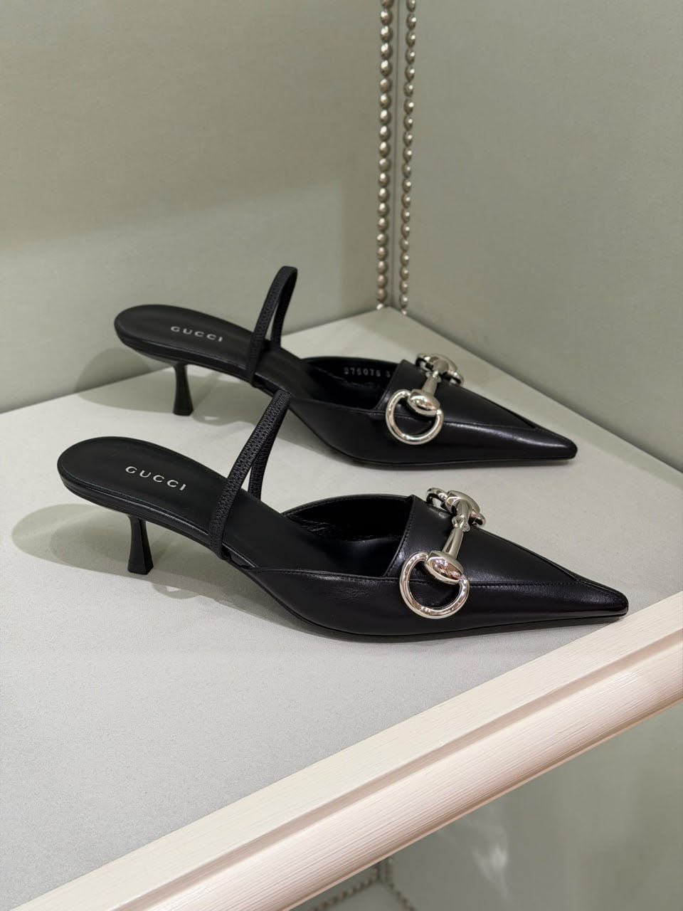 Horsebit kitten heel slingback pumps