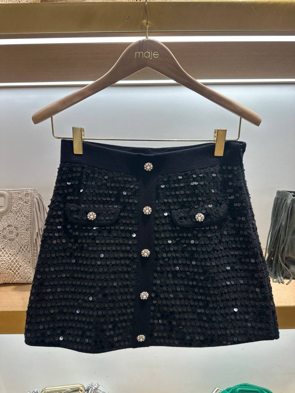 Sequined mini skirt with jewel buttons