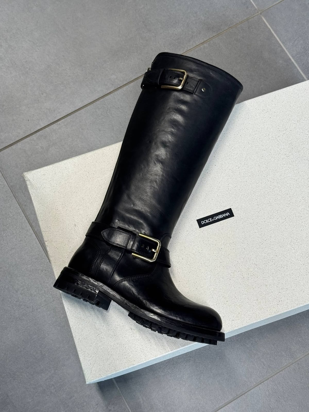 Leather knee-high boots with buckles