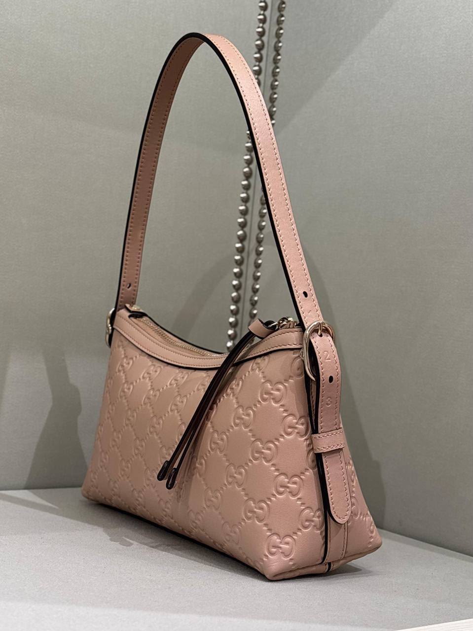 GG Embossed Shoulder Bag
