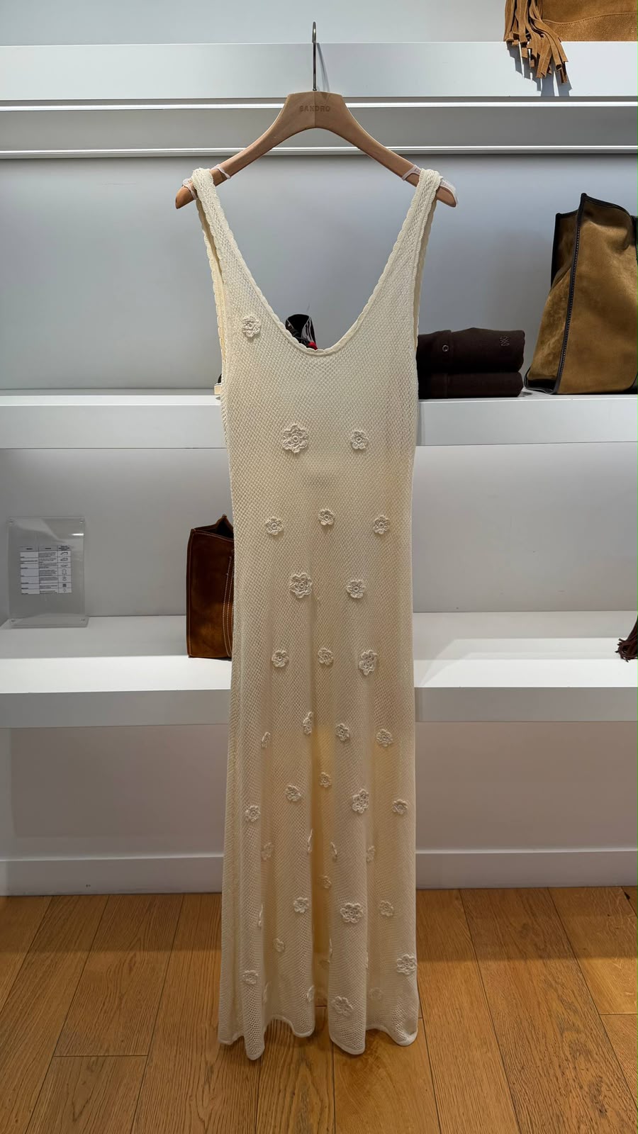 Long knit dress with floral appliqués