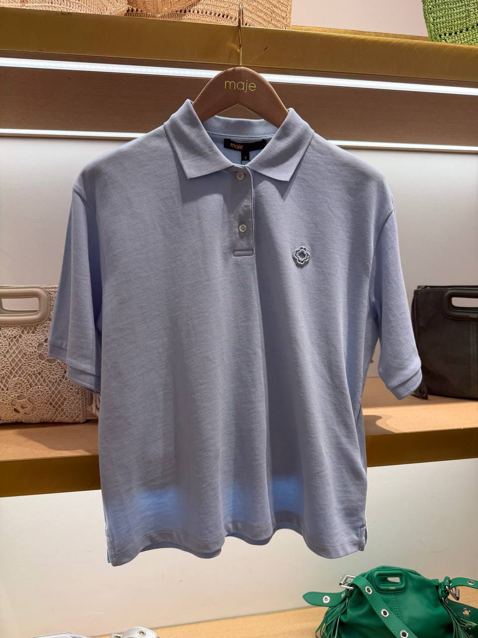 Short-sleeved polo shirt with clover logo