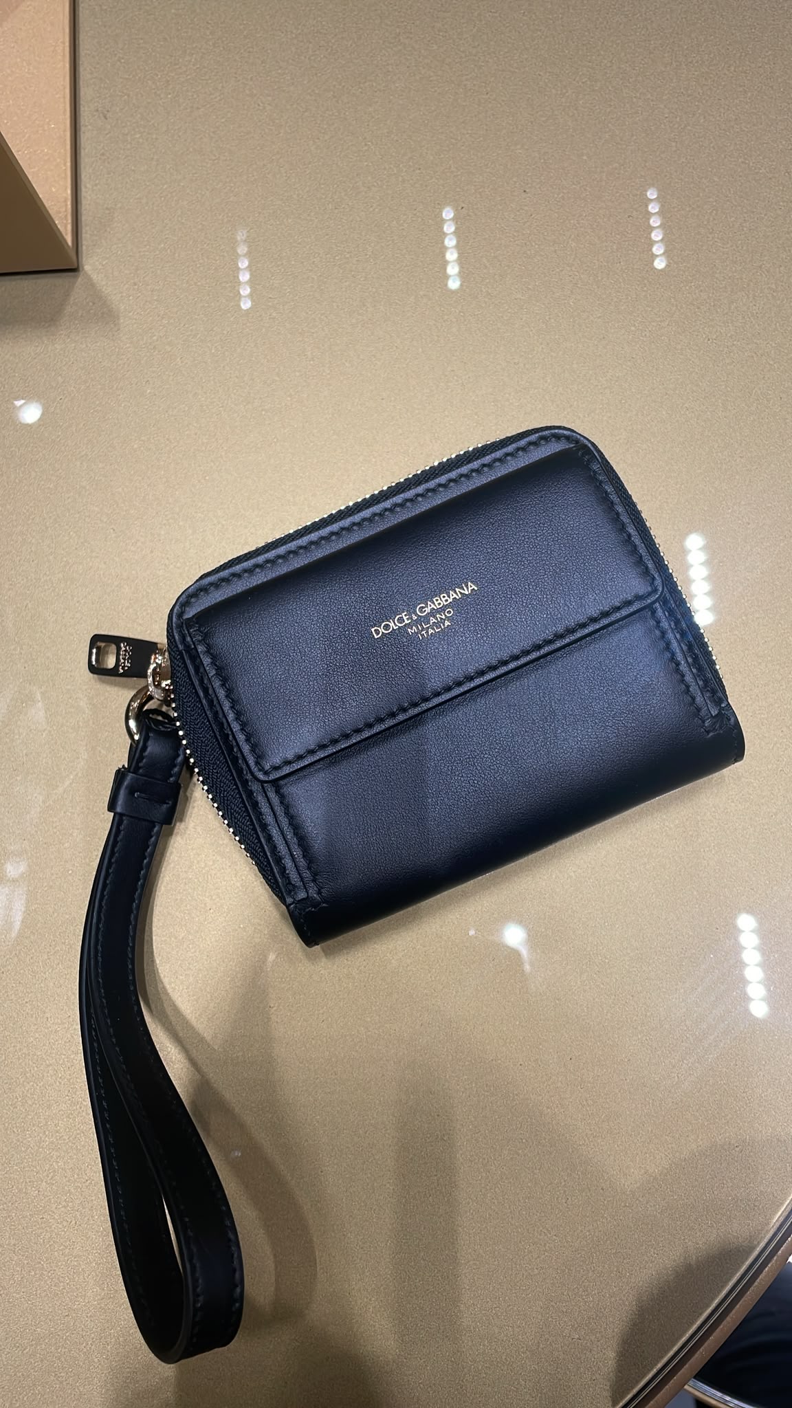 Small leather wallet with wrist strap
