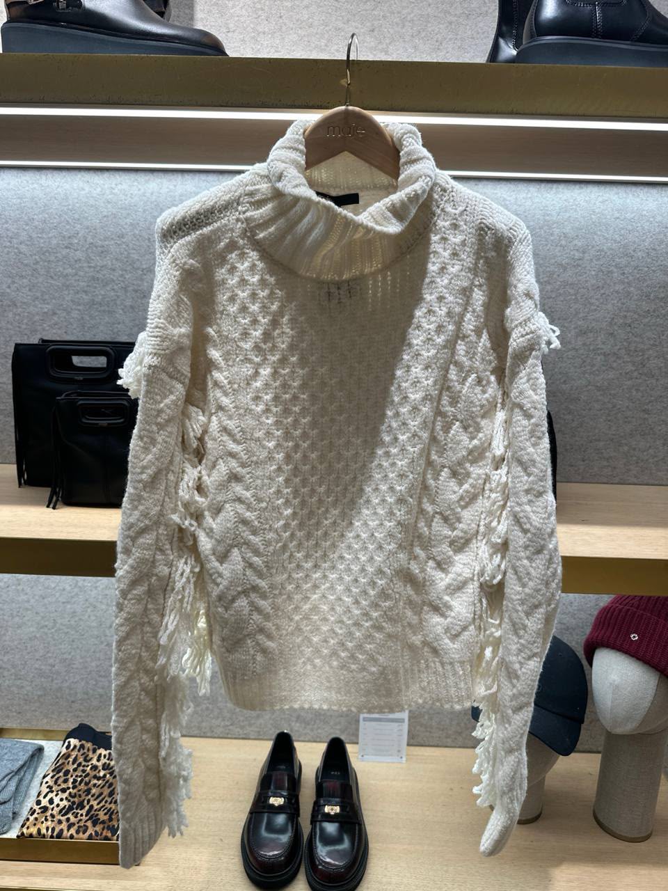 Cable-knit sweater with fringe details