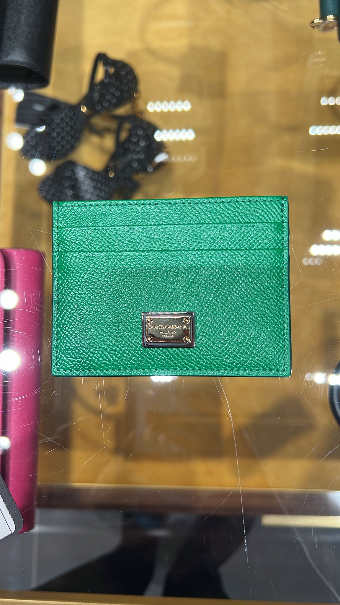 Card holder with logo plate